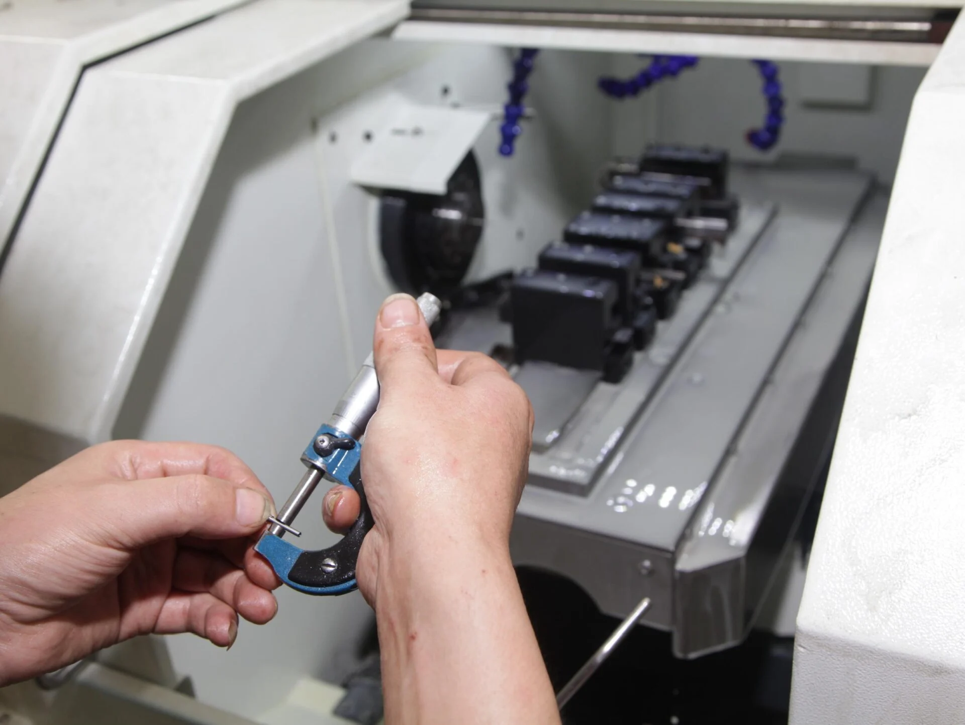 Custom metal sheet being processed in precision engineering